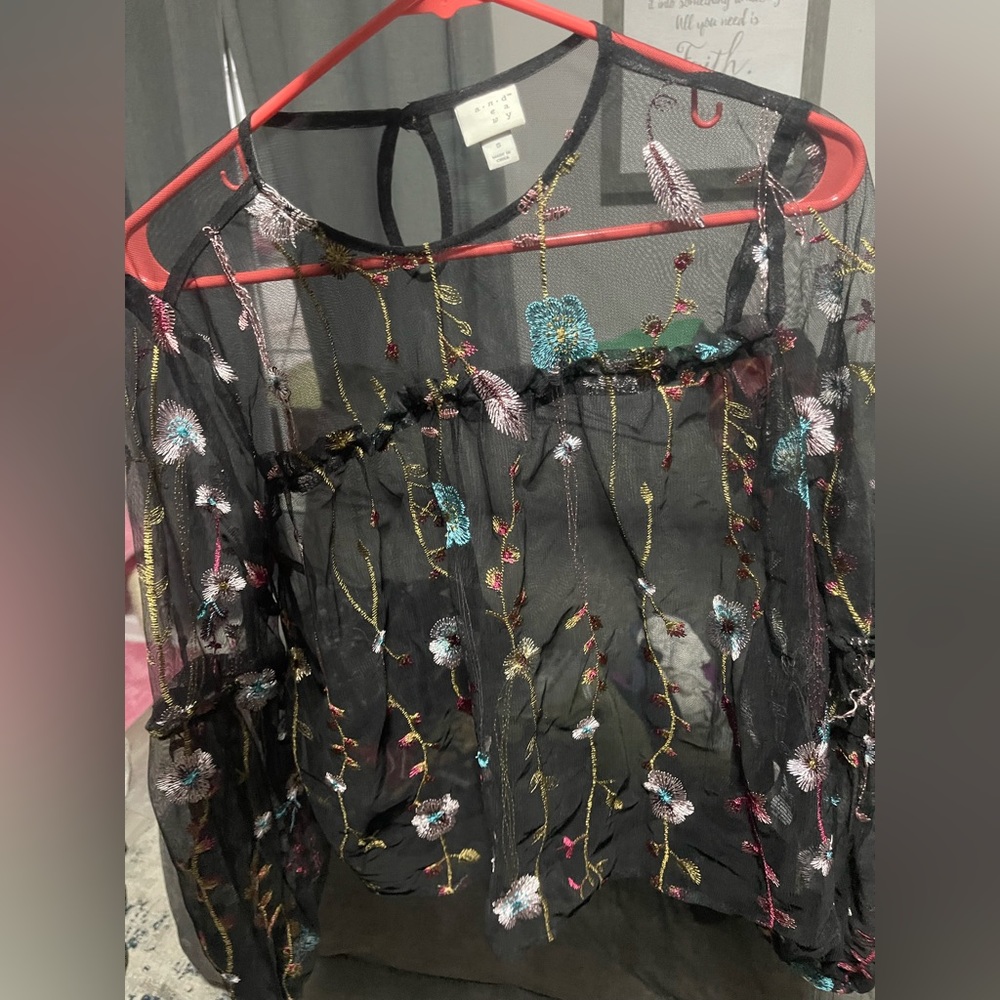 A new day sheer black blouse. It’s so pretty never been worn.